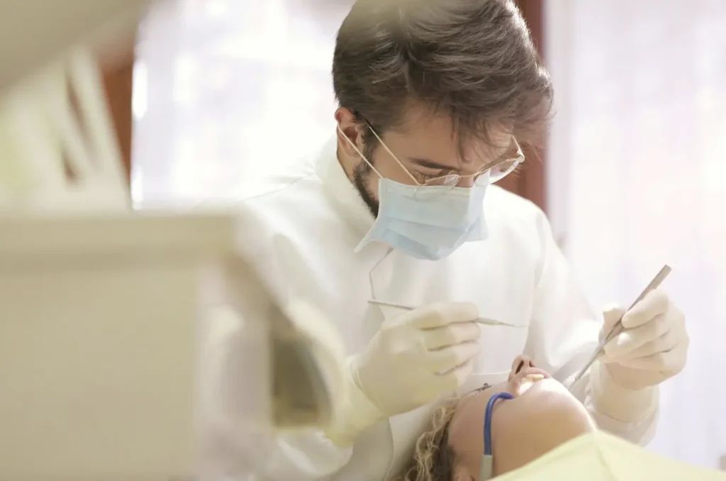 man fixing teeth 